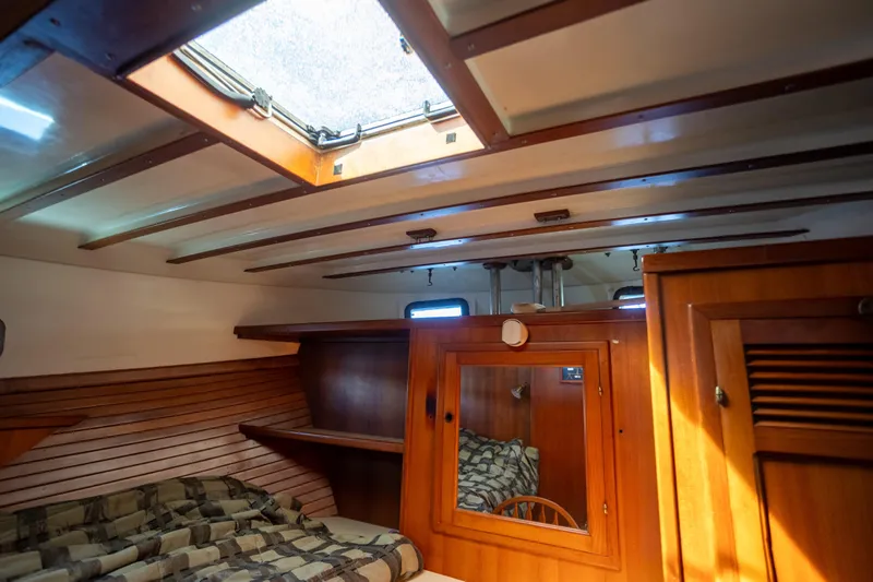 Amazing Grace Yacht Photos Pics Interior of 1983 Kadey-Krogen Manatee 36 boat, featuring wood paneling and a cozy cabin.