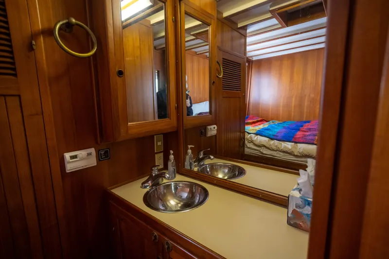 Amazing Grace Yacht Photos Pics Kadey-Krogen Manatee 36, 1983 yacht interior with wooden cabinetry and dual sinks.