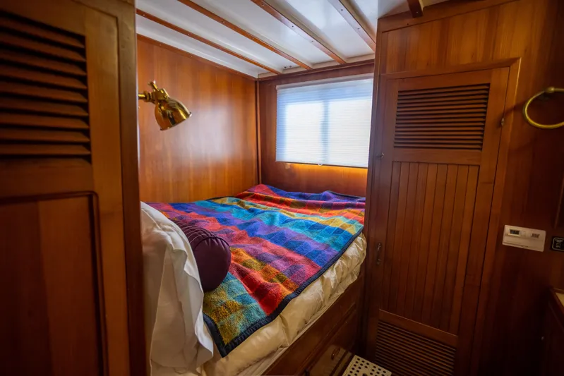 Amazing Grace Yacht Photos Pics Cozy cabin interior of 1983 Kadey-Krogen Manatee 36 with colorful blanket.