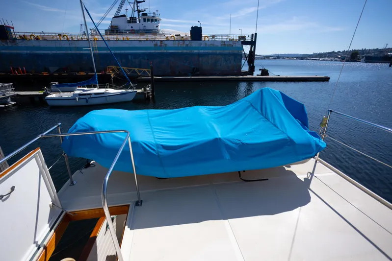 Amazing Grace Yacht Photos Pics 1983 Kadey-Krogen Manatee 36 yacht with blue cover docked at marina.