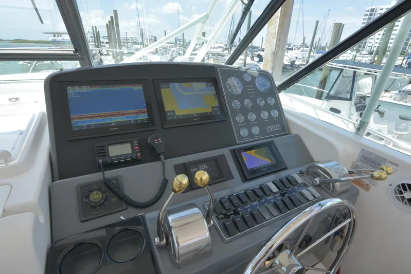 Uncouth Yacht Photos Pics Helm station of 2000 Tiara Yachts 4100 Open with navigation and control instruments.