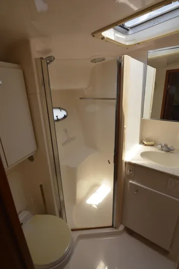 Uncouth Yacht Photos Pics 2000 Tiara Yachts 4100 Open bathroom with shower, sink, and toilet.