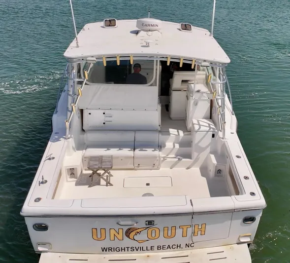 Uncouth Yacht Photos Pics 2000 Tiara Yachts 4100 Open boat on water, Wrightsville Beach, NC.