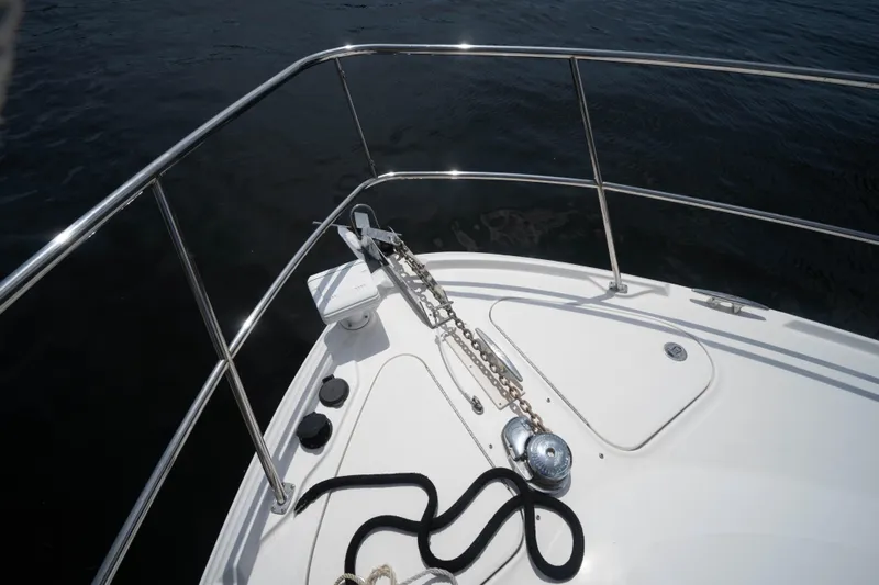 Yacht Photos Pics Bow of 2006 Sea Ray 48 Sundancer with anchor chain and railing.
