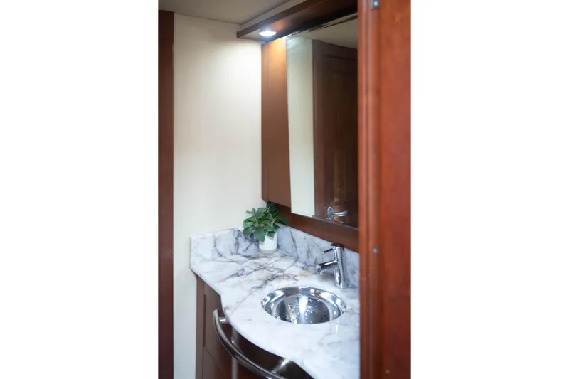  Yacht Photos Pics Luxurious bathroom interior of 2006 Sea Ray 48 Sundancer yacht with marble countertop.