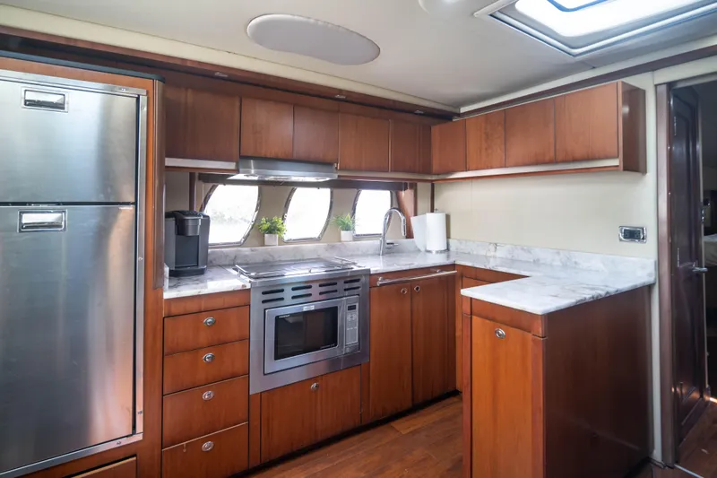  Yacht Photos Pics Luxurious kitchen interior of 2006 Sea Ray 48 Sundancer yacht with modern appliances.