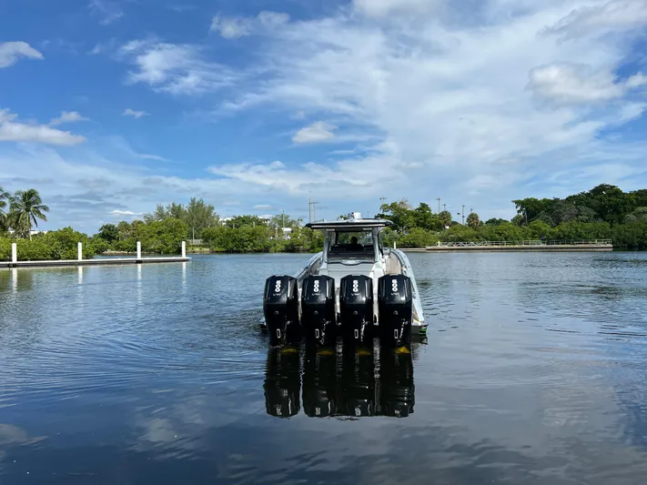  Yacht Photos Pics 2024 Nor-Tech 500 Sport boat with four engines on a calm lake.