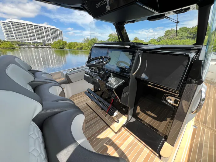  Yacht Photos Pics 2024 Nor-Tech 500 Sport boat interior with modern dashboard and luxurious seating.