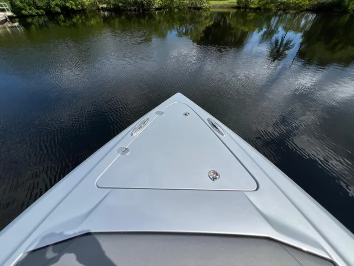  Yacht Photos Pics 2024 Nor-Tech 500 Sport boat on calm water, showcasing sleek bow design.