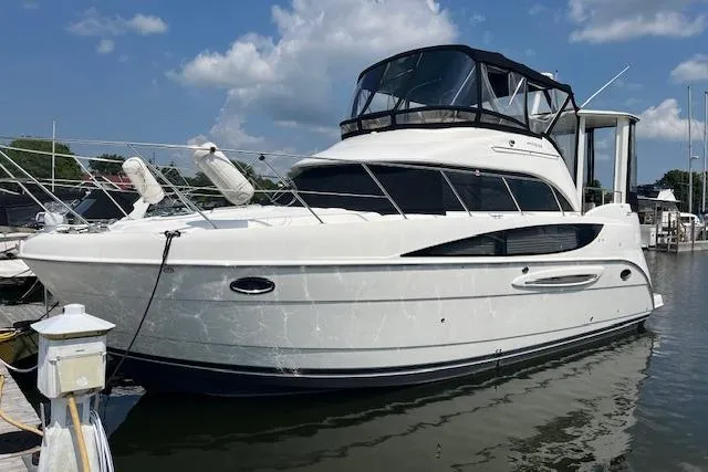 The Wanderer Yacht Photos Pics 2005 Meridian 368 Motoryacht docked in a marina under a clear blue sky.