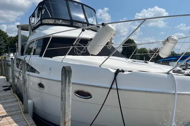 The Wanderer Yacht Photos Pics 2005 Meridian 368 Motoryacht docked, featuring sleek design and spacious deck.