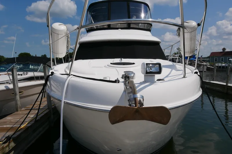 The Wanderer Yacht Photos Pics 2005 Meridian 368 Motoryacht docked at marina under blue sky.