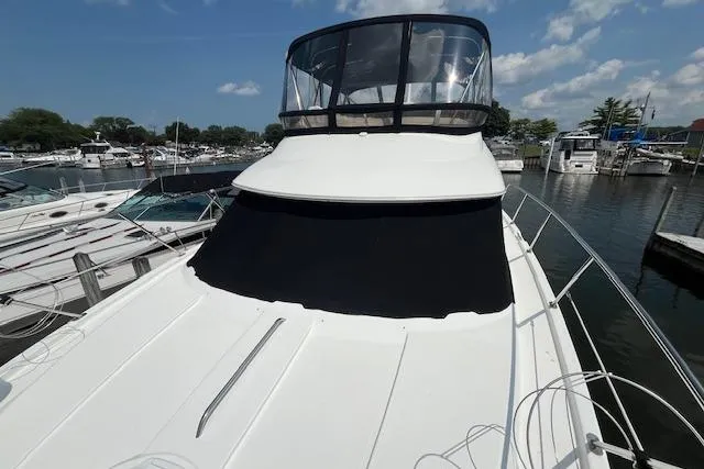 The Wanderer Yacht Photos Pics 2005 Meridian 368 Motoryacht docked at a marina under a clear blue sky.