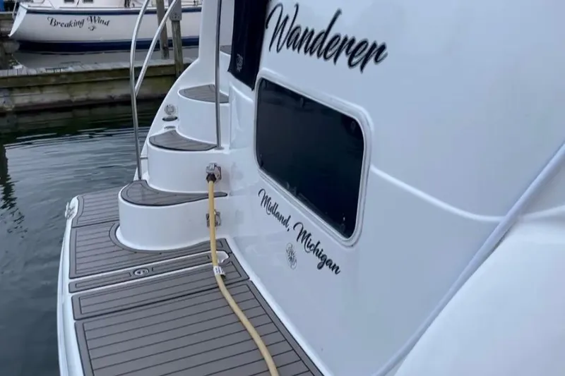 The Wanderer Yacht Photos Pics 2005 Meridian 368 Motoryacht docked, featuring "Wanderer" name and Midland, Michigan location.