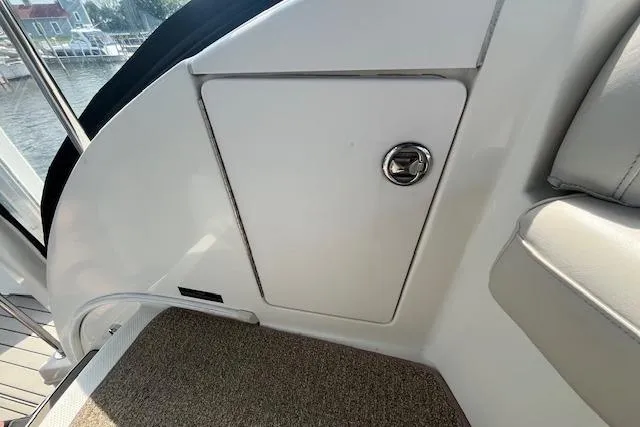 The Wanderer Yacht Photos Pics 2005 Meridian 368 Motoryacht interior detail with storage compartment and seating.