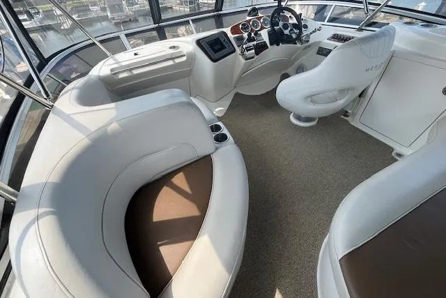 The Wanderer Yacht Photos Pics 2005 Meridian 368 Motoryacht interior with plush seating and modern helm controls.