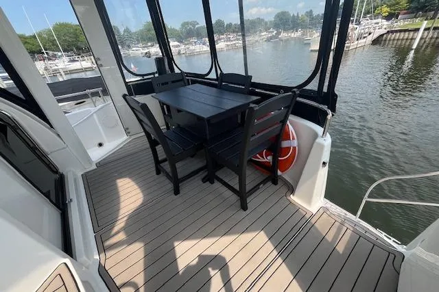 The Wanderer Yacht Photos Pics 2005 Meridian 368 Motoryacht deck with dining area overlooking marina.