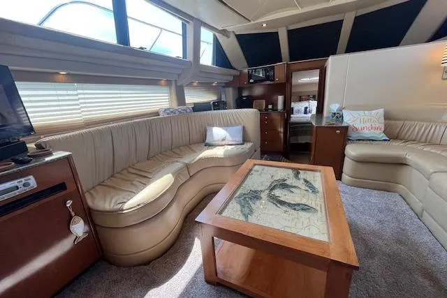 The Wanderer Yacht Photos Pics Luxurious interior of 2005 Meridian 368 Motoryacht with plush seating and elegant decor.