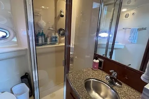 The Wanderer Yacht Photos Pics 2005 Meridian 368 Motoryacht bathroom with shower, sink, and toiletries.