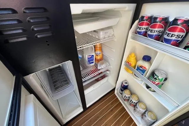 The Wanderer Yacht Photos Pics Refrigerator stocked with drinks and condiments on a 2005 Meridian 368 Motoryacht.