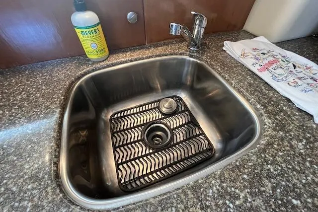 The Wanderer Yacht Photos Pics Stainless steel sink in 2005 Meridian 368 Motoryacht kitchen with soap and towel.