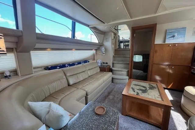 The Wanderer Yacht Photos Pics Luxurious interior of 2005 Meridian 368 Motoryacht with plush seating and elegant decor.