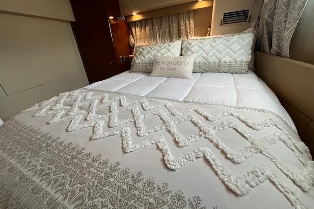 The Wanderer Yacht Photos Pics Luxurious bedroom interior of 2005 Meridian 368 Motoryacht with elegant bedding.