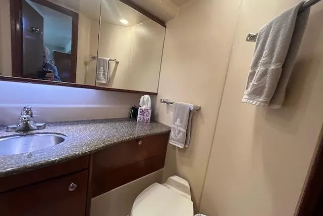 The Wanderer Yacht Photos Pics Bathroom interior of 2005 Meridian 368 Motoryacht with sink, mirror, and towels.