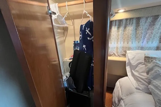 The Wanderer Yacht Photos Pics Interior of 2005 Meridian 368 Motoryacht showing closet and bed area.