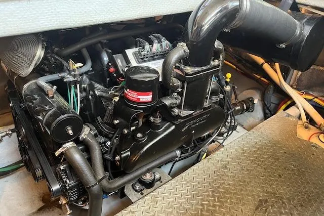 The Wanderer Yacht Photos Pics Engine compartment of a 2005 Meridian 368 Motoryacht, showcasing mechanical components and piping.