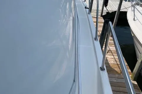 The Wanderer Yacht Photos Pics 2005 Meridian 368 Motoryacht docked, showing sleek side view and railing.