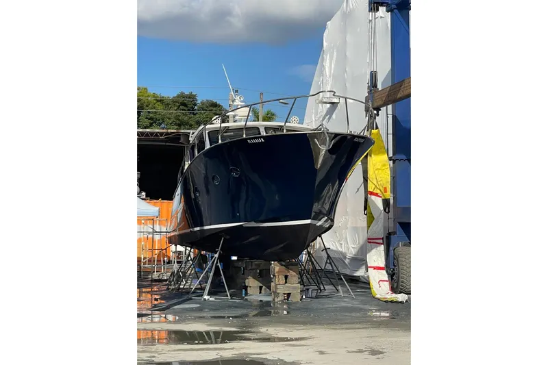  Yacht Photos Pics Custom NNS Sea Scout 41 boat, 2007 model, docked for maintenance under clear skies.