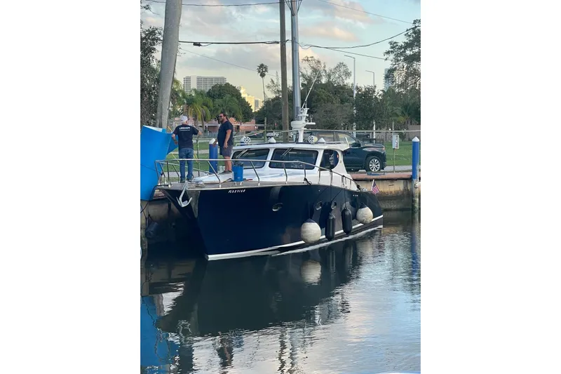  Yacht Photos Pics Custom NNS Sea Scout 41 yacht docked, 2007 model, with people on deck.
