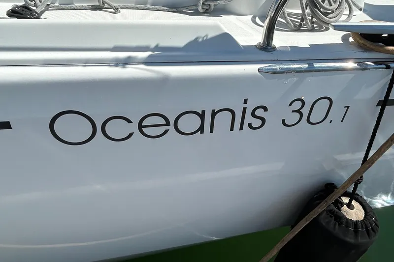 Polaris Yacht Photos Pics 2021 Beneteau Oceanis 30.1 sailboat with visible name and dock ropes.