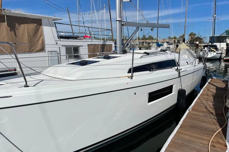 Polaris Yacht Photos Pics 2021 Beneteau Oceanis 30.1 sailboat docked at marina under clear blue sky.