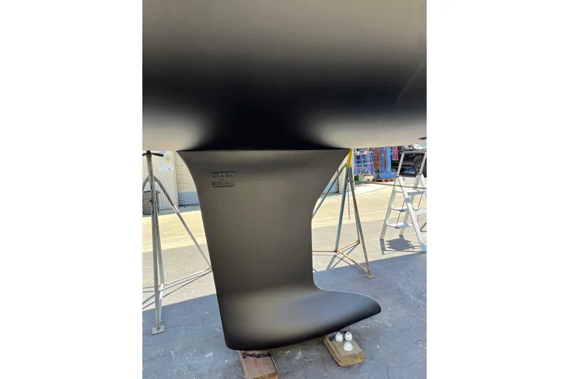 Polaris Yacht Photos Pics 2021 Beneteau Oceanis 30.1 keel in dry dock, showcasing sleek design and craftsmanship.