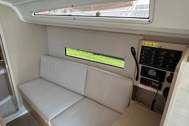 Polaris Yacht Photos Pics Interior of 2021 Beneteau Oceanis 30.1 yacht with seating and control panel.