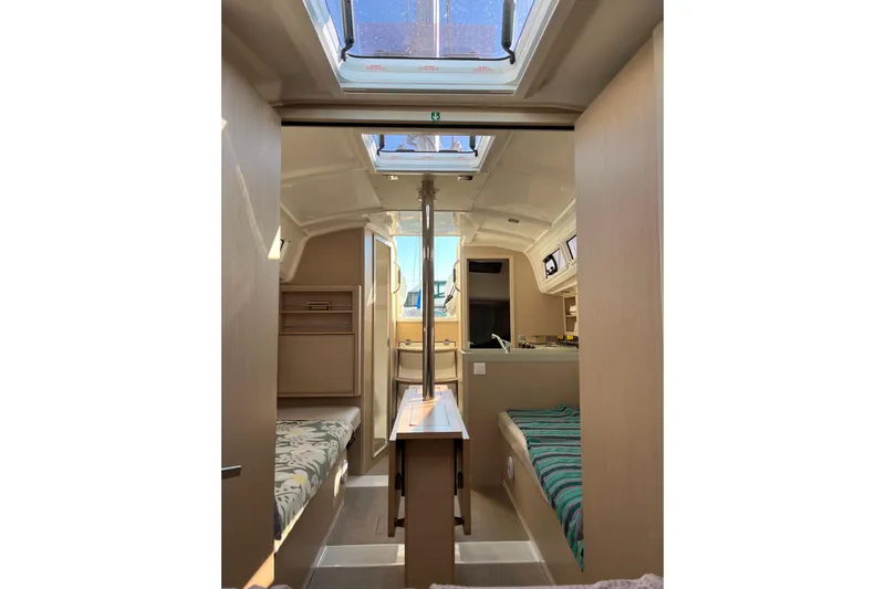 Polaris Yacht Photos Pics Interior of 2021 Beneteau Oceanis 30.1 sailboat, featuring cozy cabins and skylights.