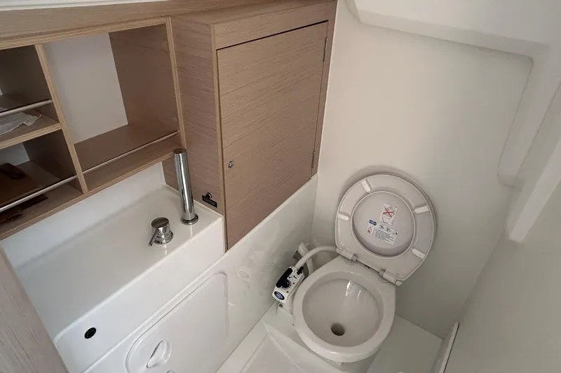 Polaris Yacht Photos Pics Beneteau Oceanis 30.1 2021 yacht bathroom with compact toilet and sink.