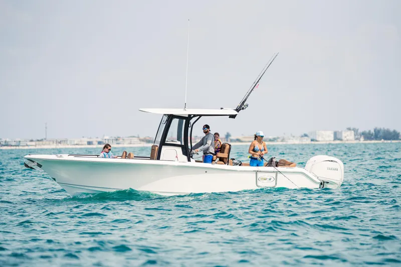  Yacht Photos Pics 2026 Sea Hunt Ultra 265 SE boat with people fishing on open water.