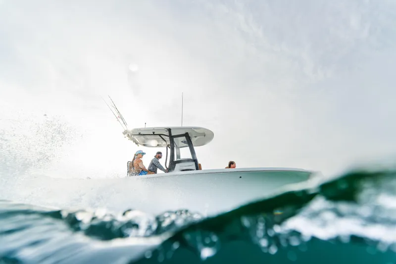  Yacht Photos Pics 2026 Sea Hunt Ultra 265 SE boat navigating through ocean waves.