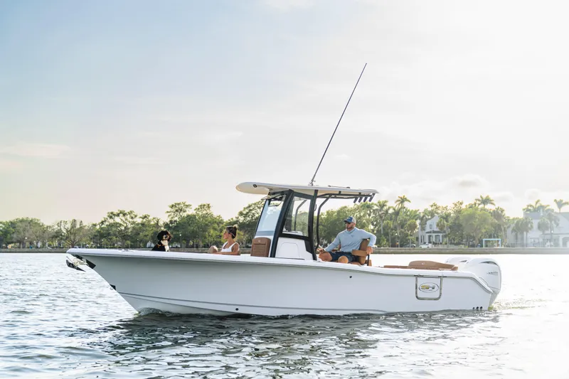  Yacht Photos Pics 2026 Sea Hunt Ultra 265 SE boat cruising on a sunny day with passengers.