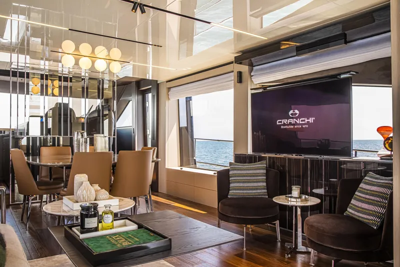  Yacht Photos Pics Luxurious interior of 2026 Cranchi Sessantasette 67 Fly yacht with elegant seating and decor.