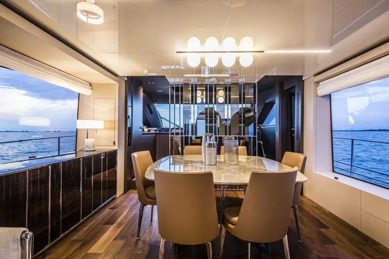  Yacht Photos Pics Luxurious interior of 2026 Cranchi Sessantasette 67 Fly yacht with elegant dining area.