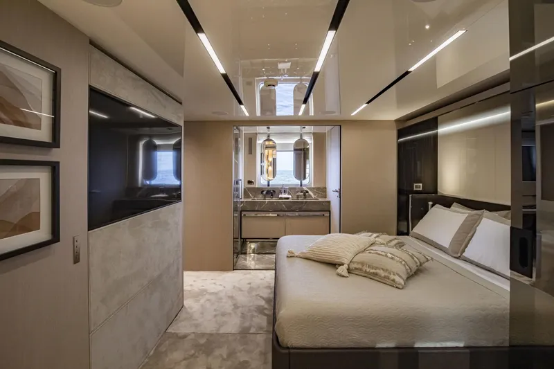  Yacht Photos Pics Luxurious bedroom interior of 2026 Cranchi Sessantasette 67 Fly yacht, featuring modern design and elegant decor.