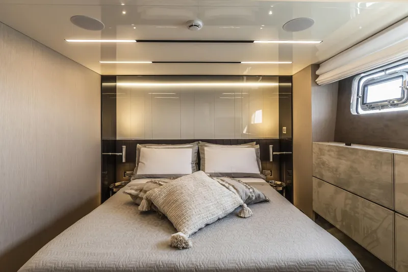  Yacht Photos Pics Luxurious bedroom interior of 2026 Cranchi Sessantasette 67 Fly yacht with modern design.