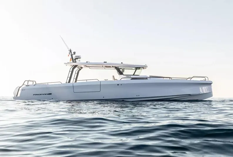  Yacht Photos Pics 2025 Axopar 45 Cross Top boat on calm ocean waters.