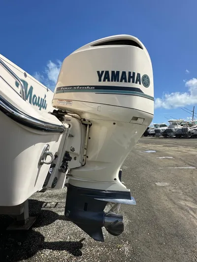  Yacht Photos Pics 2018 Grady-White Canyon 336 with Yamaha outboard motor in a sunny marina.