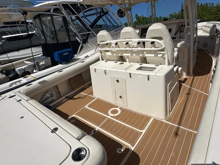  Yacht Photos Pics 2018 Grady-White Canyon 336 boat interior with seating and storage on deck.