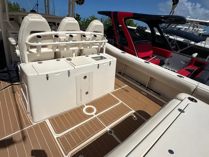  Yacht Photos Pics 2018 Grady-White Canyon 336 boat interior with seating and storage on deck.